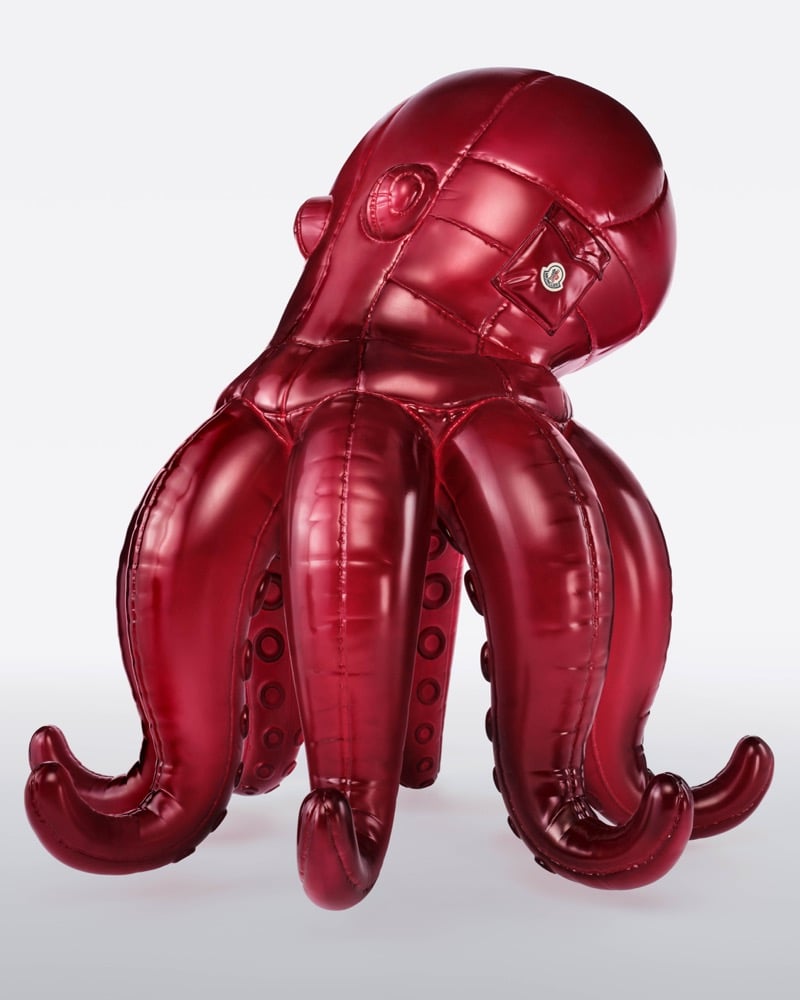 A metallic red Moncler puffer octopus with curling tentacles and a Moncler logo patch