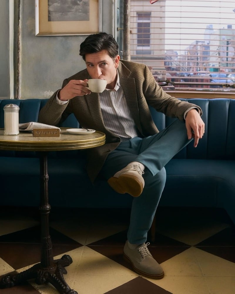 Braun wears a tweed jacket over a striped shirt with Bonobos chinos