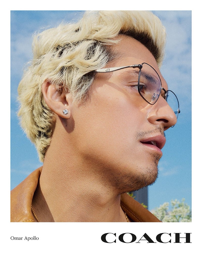 Omar Apollo wears Coach glasses for the brand's spring 2026 campaign