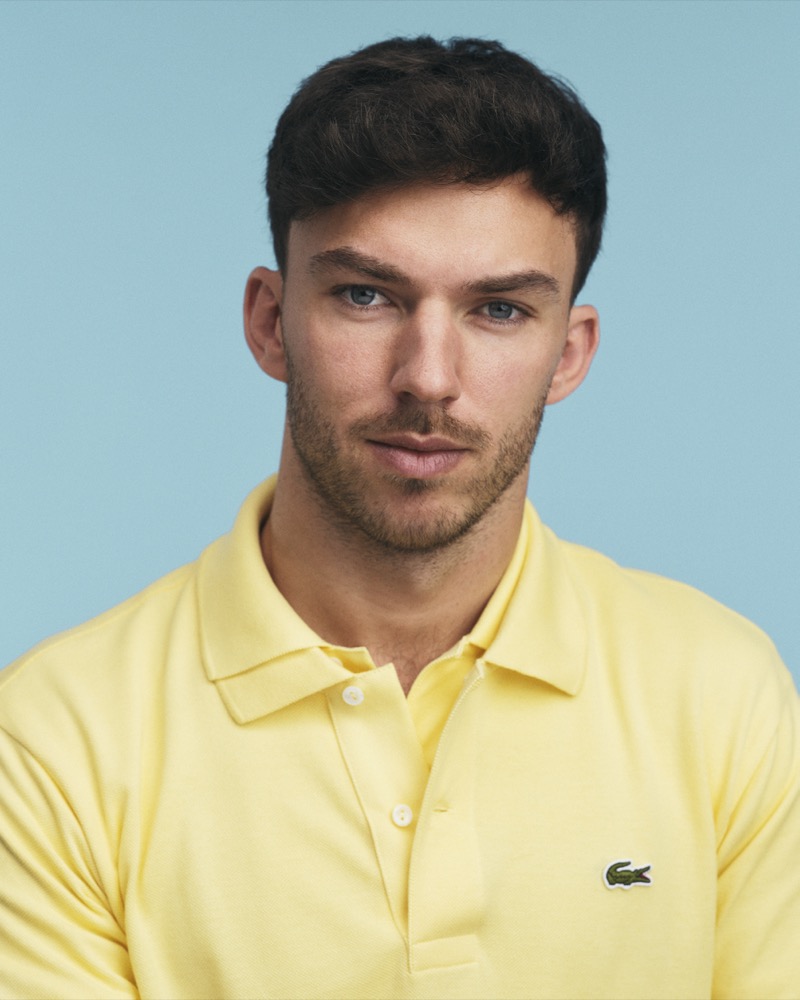 pierre gasly layers two yellow polo shirts by lacoste