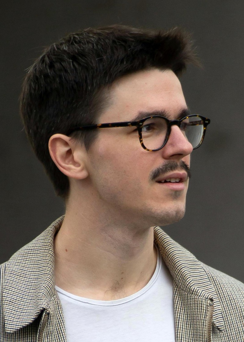 Man wearing round tortoiseshell glasses with medium acetate frames