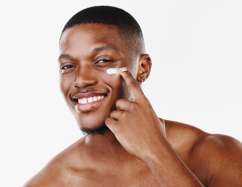 Smiling man moisturizer
