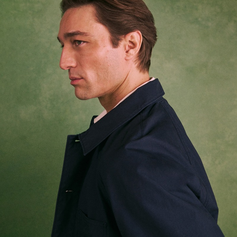 Model in profile wearing the Wallace & Barnes Lightweight Cotton Chore Jacket in navy