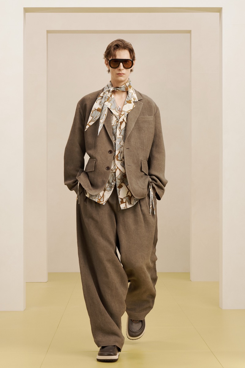 Zara SRPLS summer 2026 brown unlined linen suit with dropped shoulders and drawstring waist over a botanical-print camp shirt