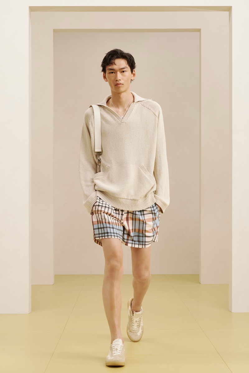 Zara SRPLS summer 2026 cream V-neck polo sweater over pastel plaid drawstring shorts with a cream shoulder bag and white sneakers