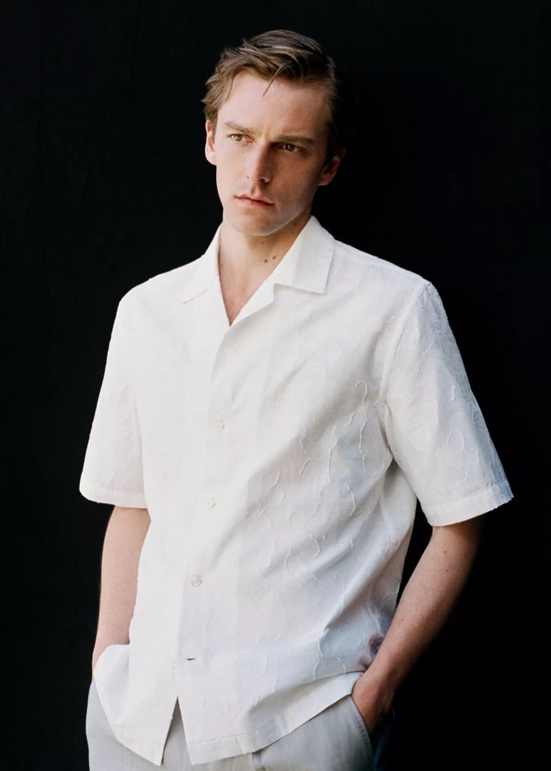 Quentin wears a Mango white tonal-patterned camp collar short-sleeve shirt against a black backdrop