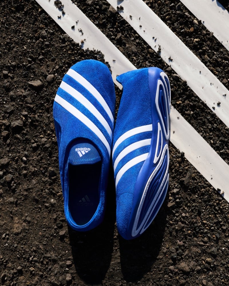Adidas Originals Pharrell Williams Virginia Vario Flat Earther in blue suede photographed from above on earth with three white Adidas stripes