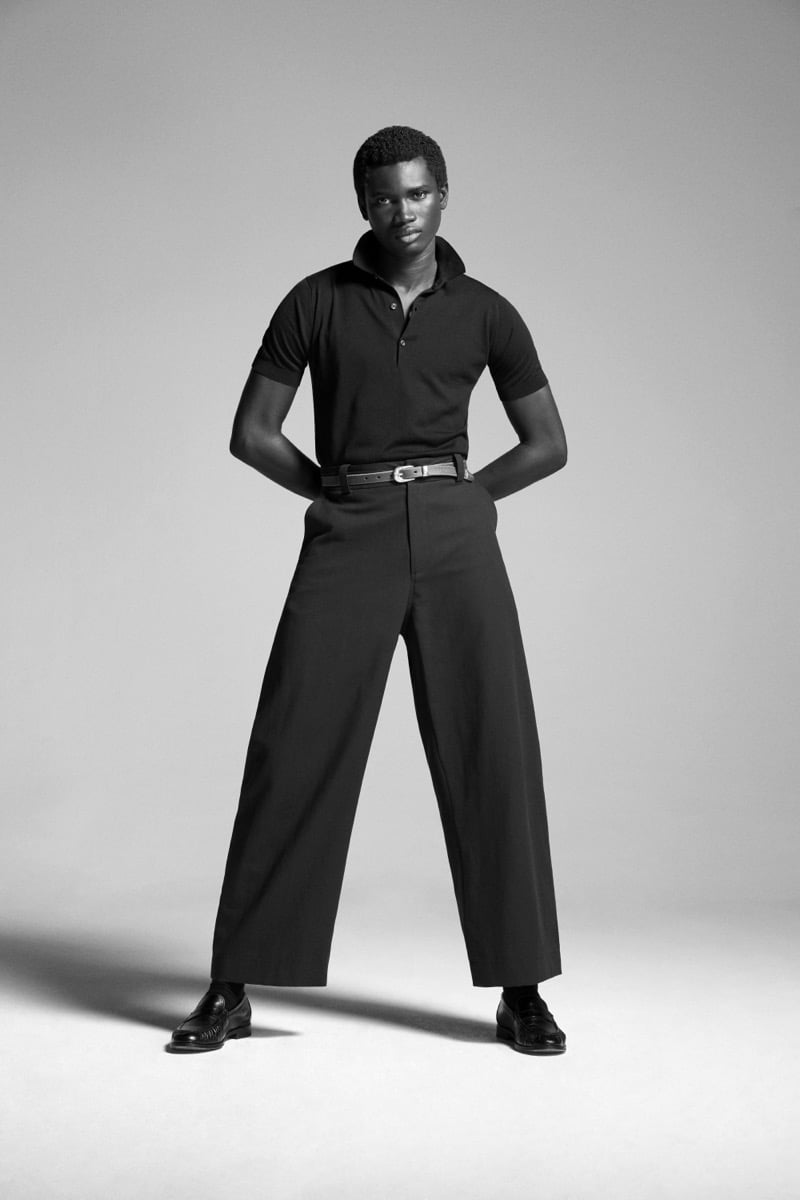 Alexander Acquah models the John Smedley Adrian Sea Island cotton short-sleeve polo with wide-leg trousers and leather loafers