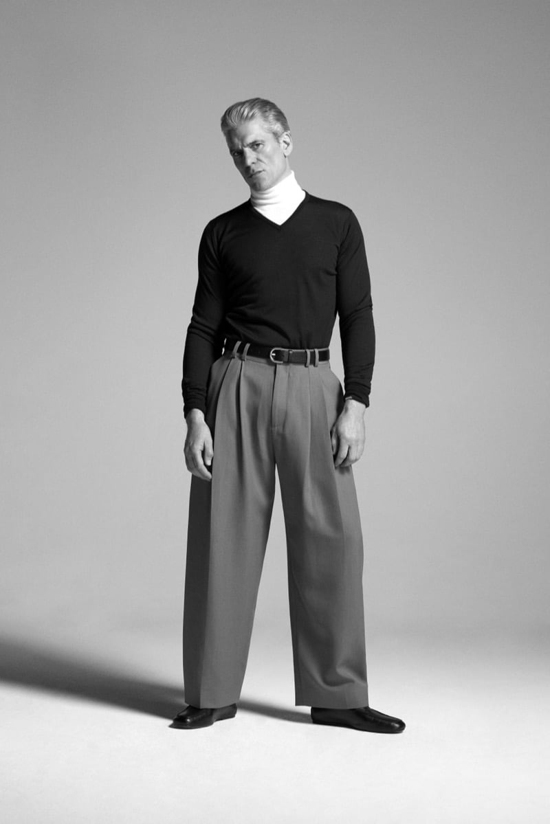 Felix Friedman in the John Smedley Bobby extra fine merino V-neck layered over a turtleneck with pleated wide-leg trousers