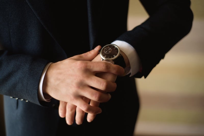 Man wearing watch with leather strap