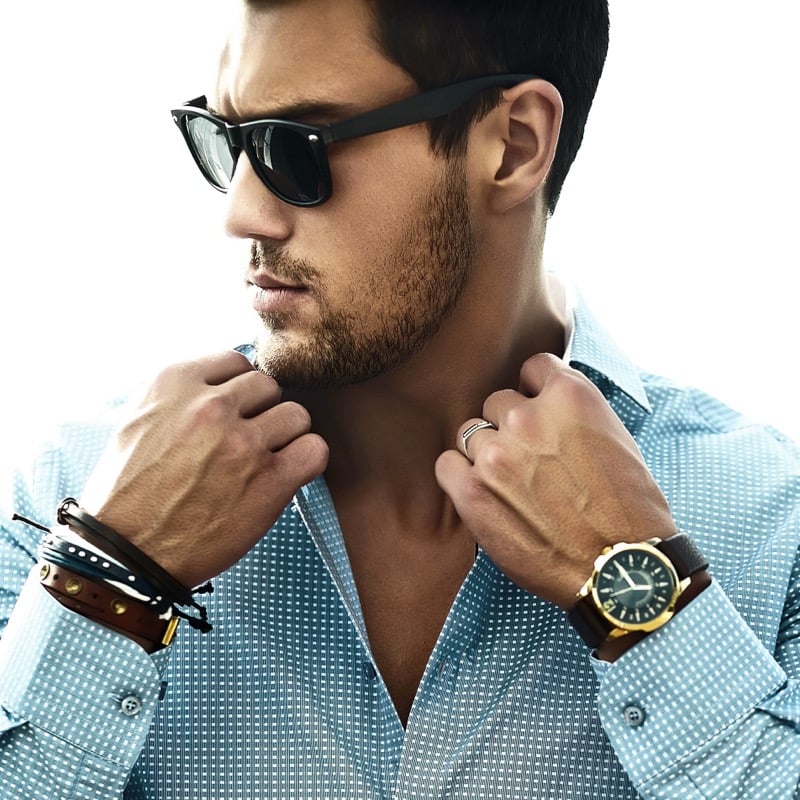 Man wearing watches and bracelets