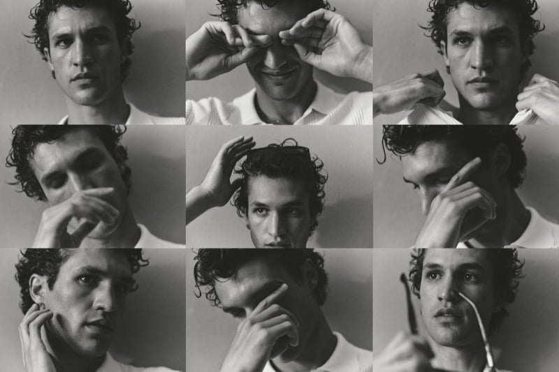 Black-and-white grid of nine close-up portraits of Francisco Henriques in a white shirt, hands moving through his curly hair and across his face