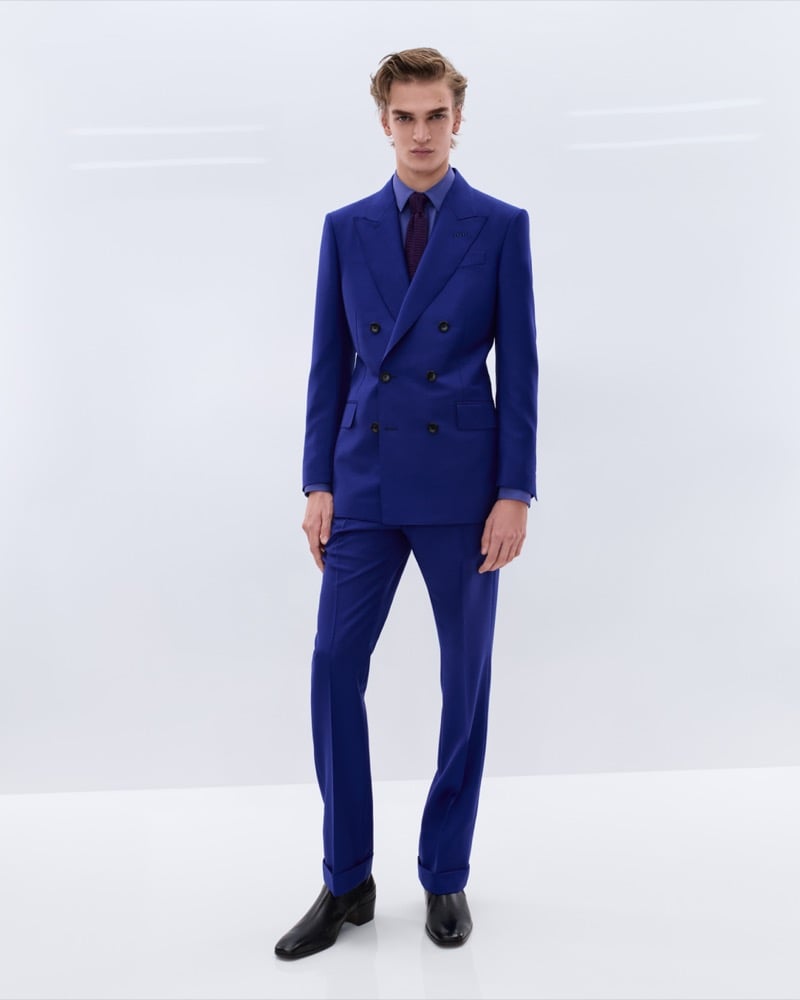 Dario Tonin wears an electric blue double-breasted single-breasted suit over a periwinkle shirt with a burgundy polka dot tie