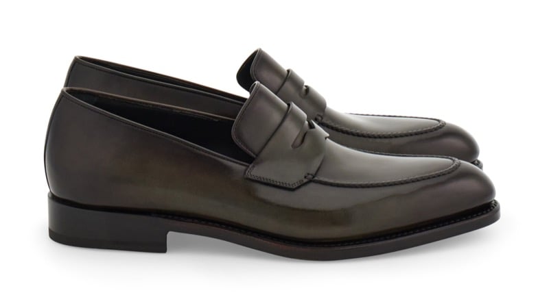 Ferragamo Tramezza polished dark olive leather penny loafer with a leather sole, shown in profile