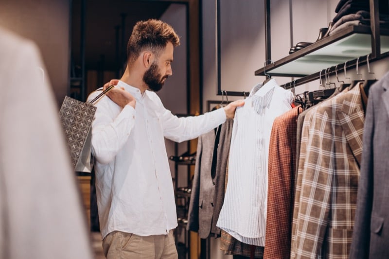 Young man shopping in a menswear store