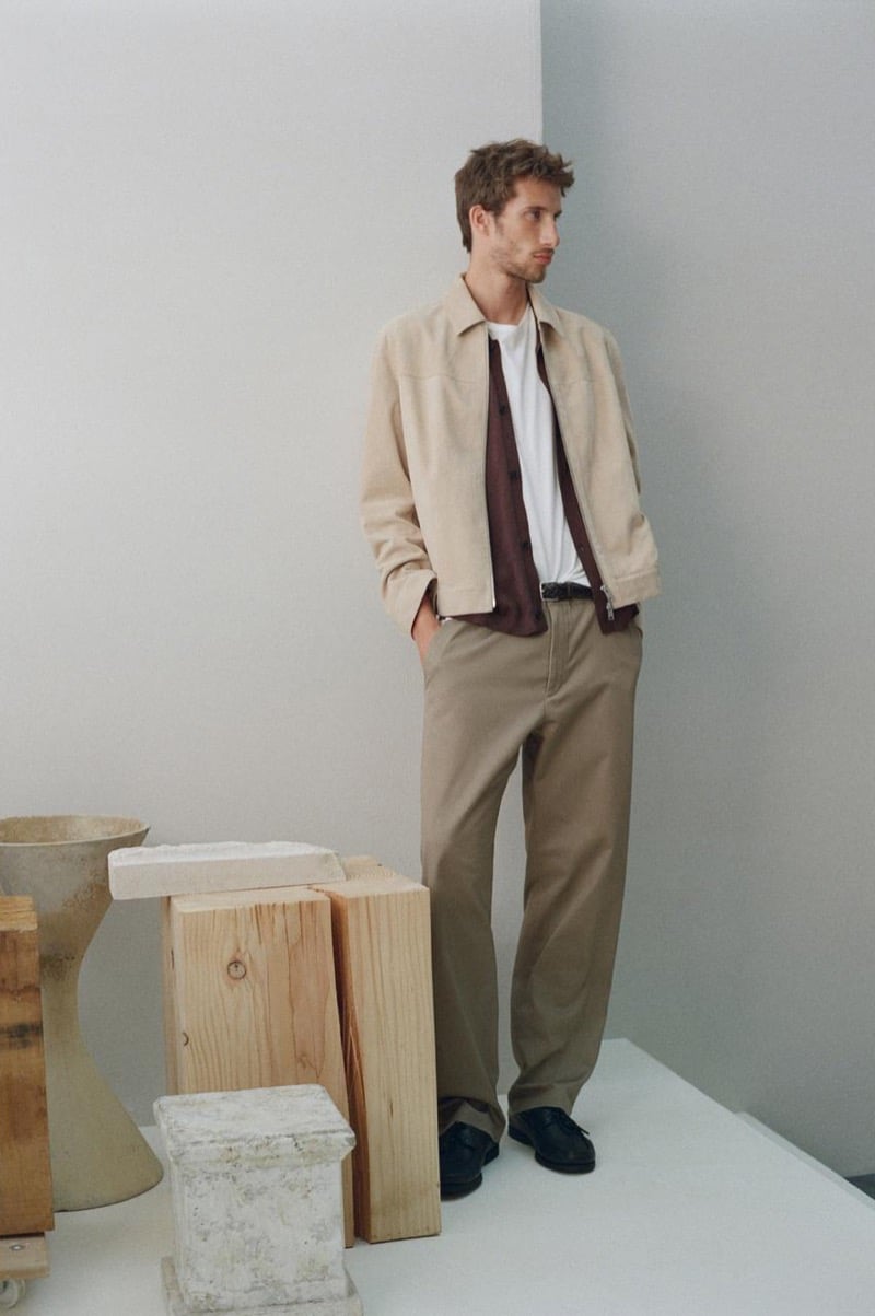 Aristide Deslandes in light layers, including a shirt jacket, short-sleeve shirt, and white t-shirt