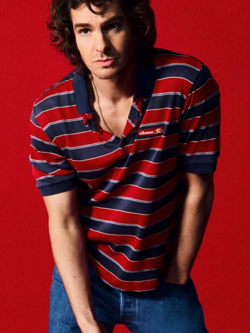 Andrew Garfield wears a red and navy striped polo shirt with jeans for ellesse's 2026 campaign