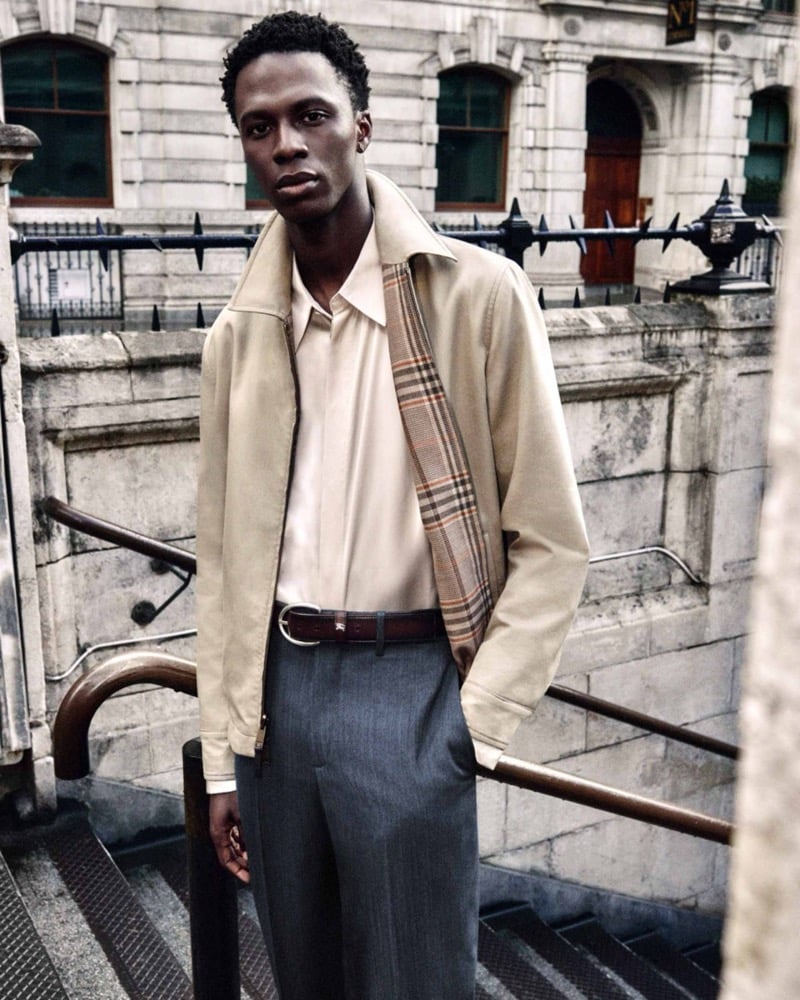 Cherif Douamba in a tan Harrington jacket with a Burberry check lining