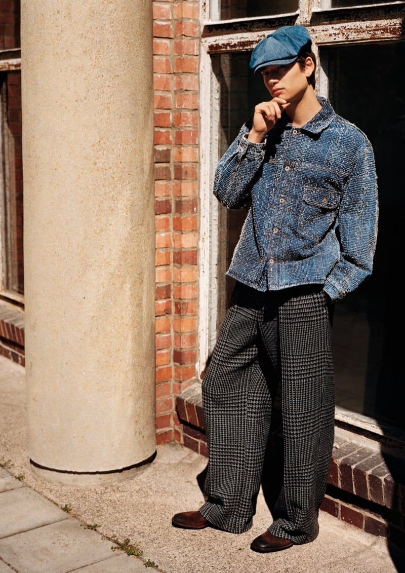 Kai W in a cropped denim jacket, wide houndstooth trousers, and a denim flat cap for Emporio Armani's fall-winter 2026 campaign
