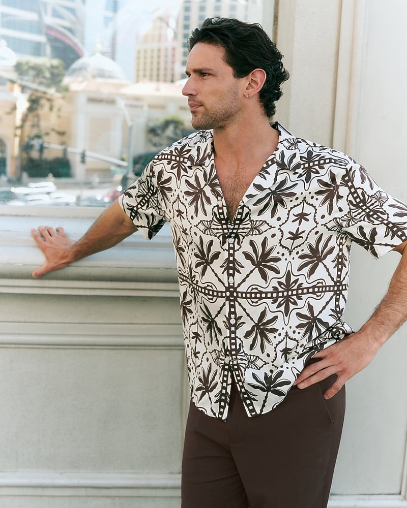 Giacomo Cavalli in an abstract palm print resort shirt with the collar open
