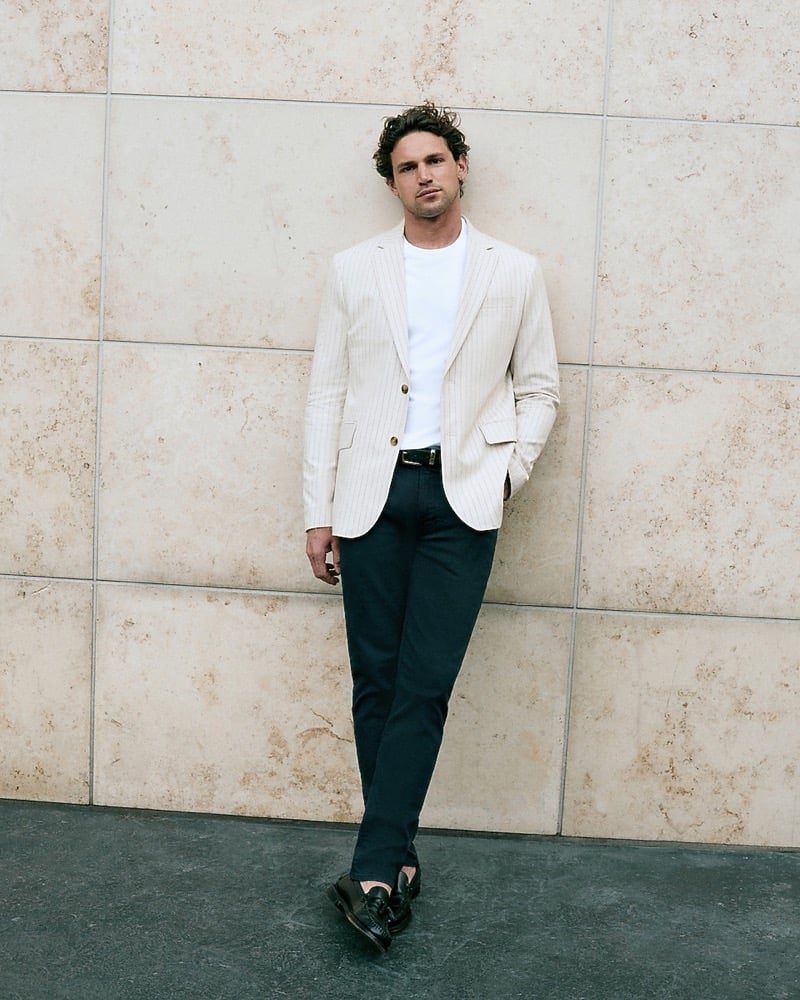 Giacomo Cavalli in a striped linen-blend suit jacket and white T-shirt