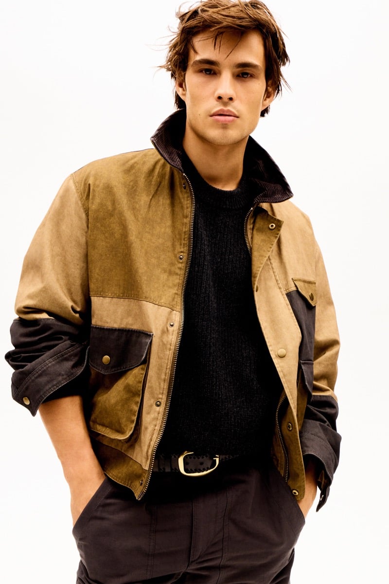 Louis Baines in a color-blocked jacket over a sweater, for Isabel Marant Fall 2026