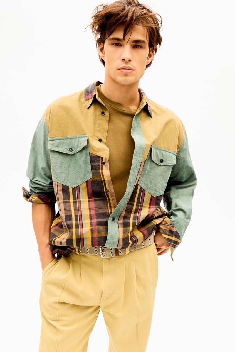 Louis Baines in a color-blocked plaid shirt and matching trousers, for Isabel Marant Fall 2026