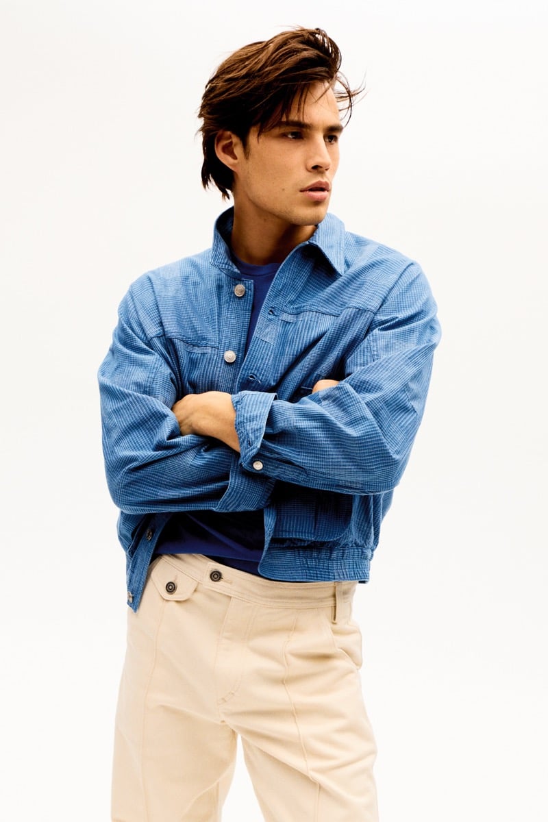 Louis Baines in a blue textured jacket over a collared shirt, for Isabel Marant Fall 2026