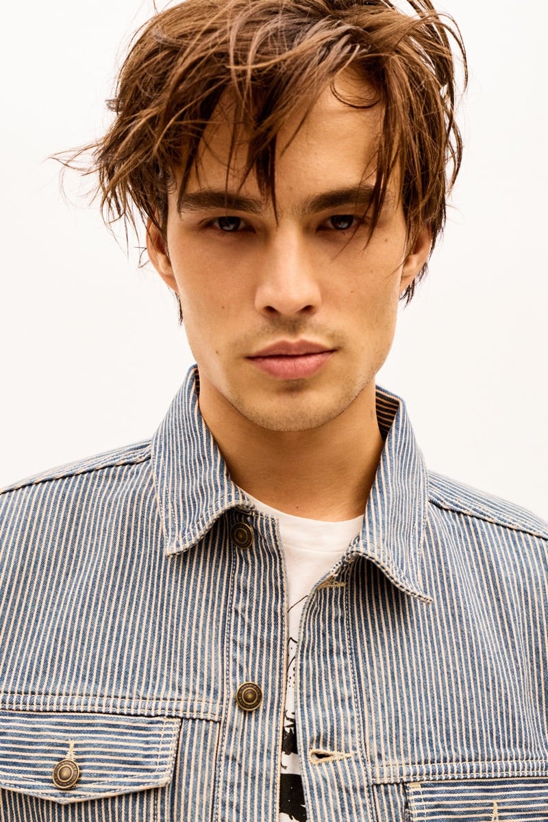 Louis Baines in a striped denim jacket over a graphic T-shirt, for Isabel Marant Fall 2026