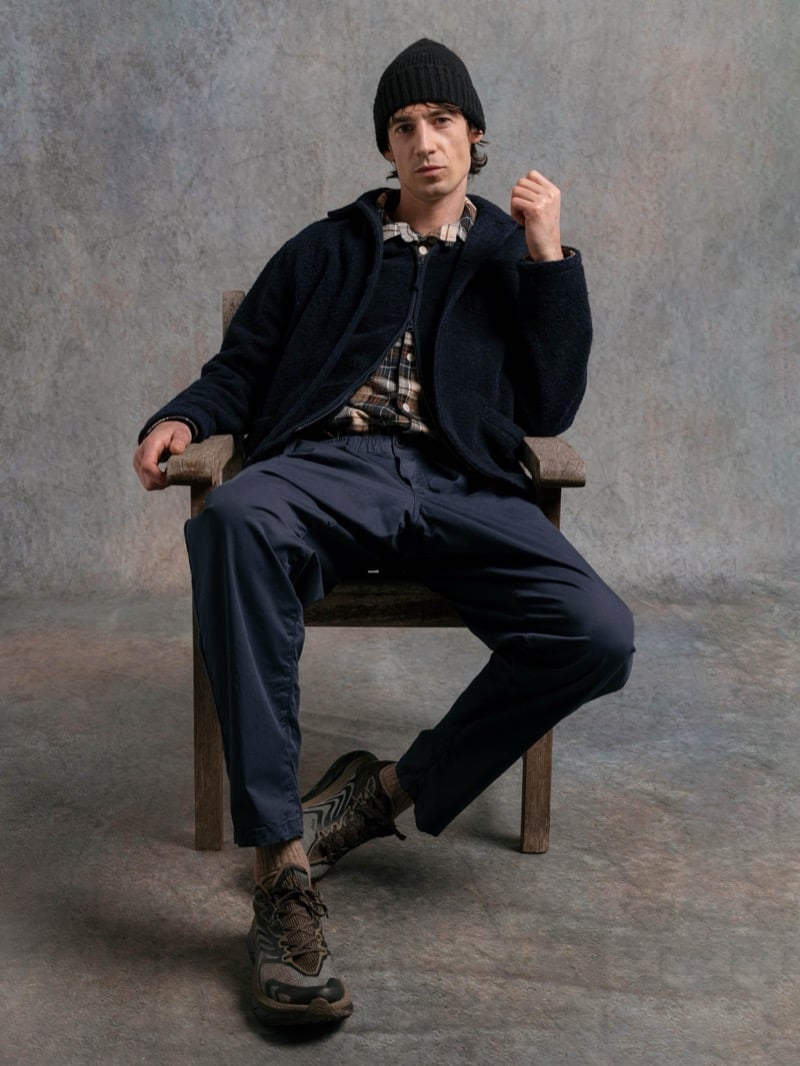 Man in a navy fleece jacket over a plaid shirt, wearing a black beanie, for Kestin Fall 2026