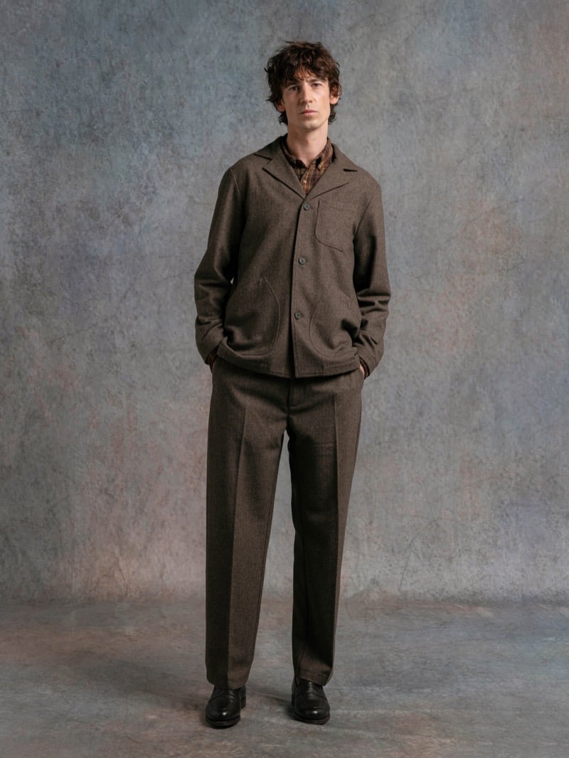 Man in a brown wool jacket over a plaid shirt and matching trousers, for Kestin Fall 2026