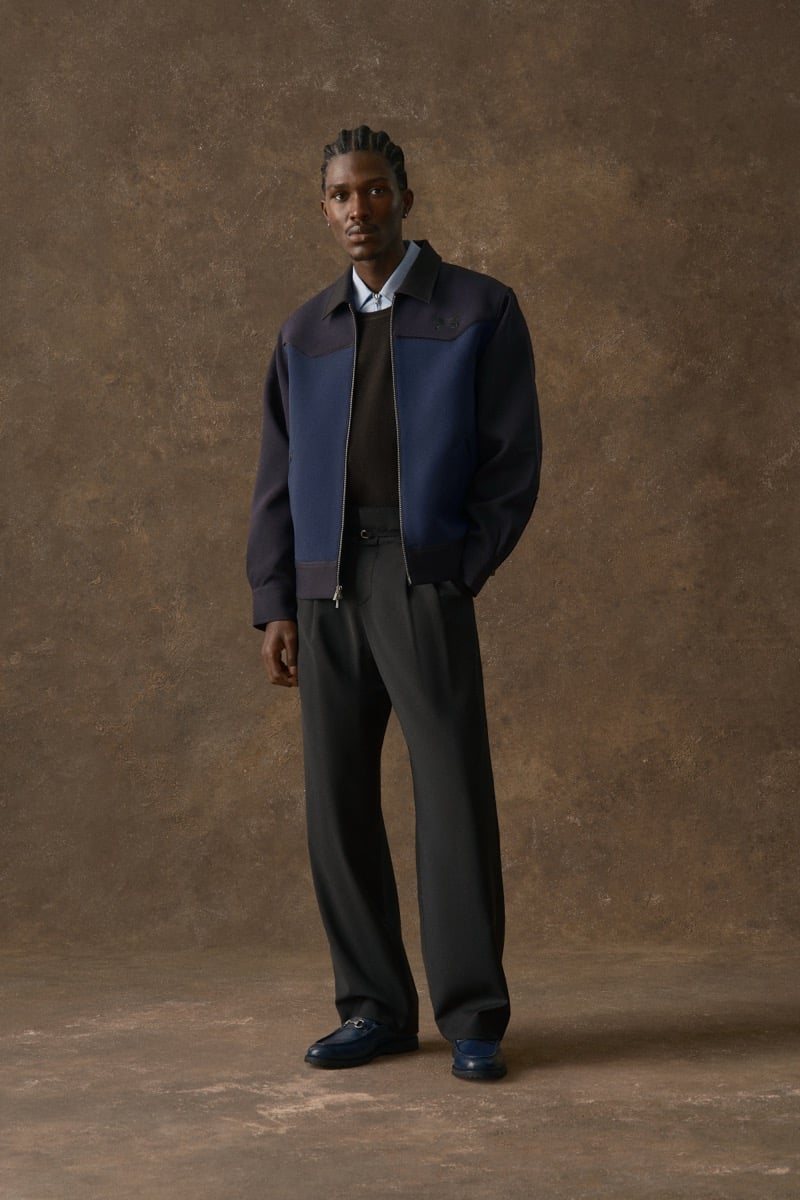Man in a colorblock jacket over a brown sweater, for Kith Fall 2026