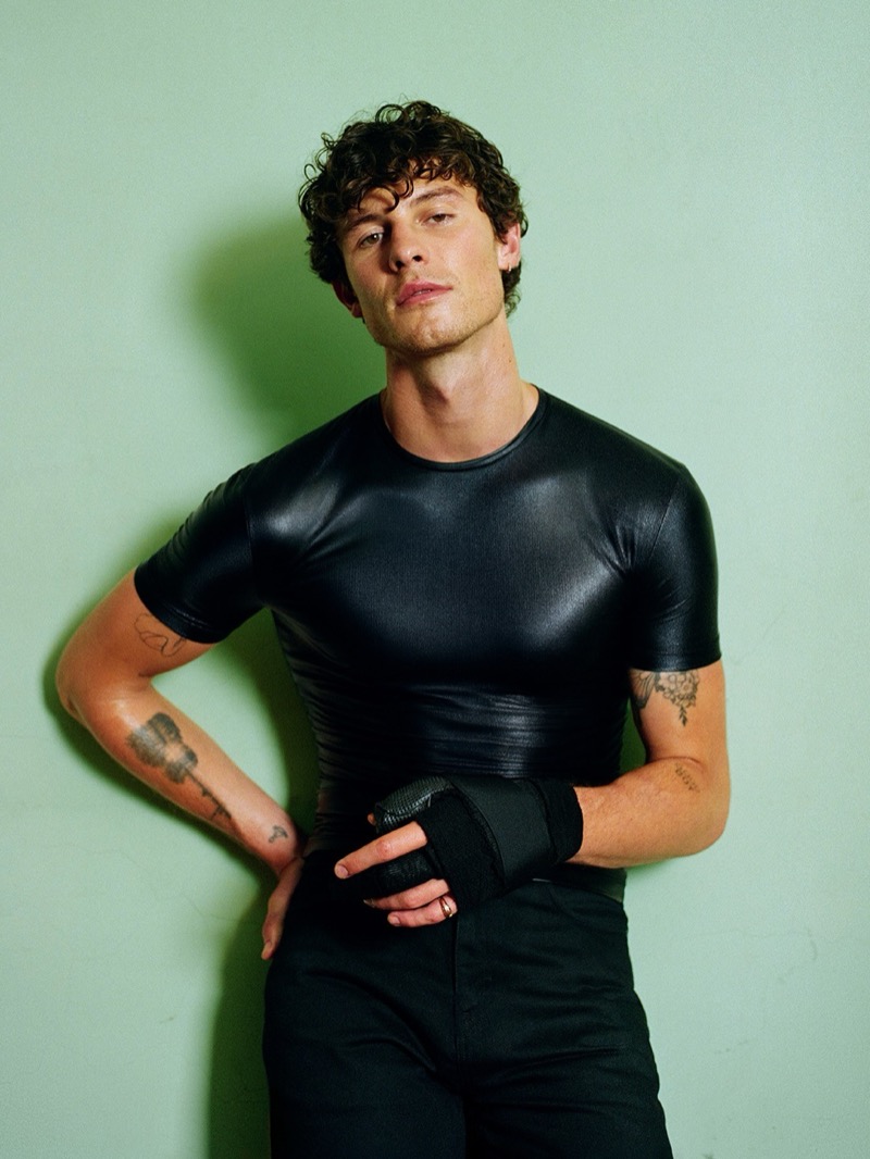 Shawn Mendes wears a body-hugging top and fingerless leather glove for Gucci's Primavera campaign, tattoos visible on his forearms