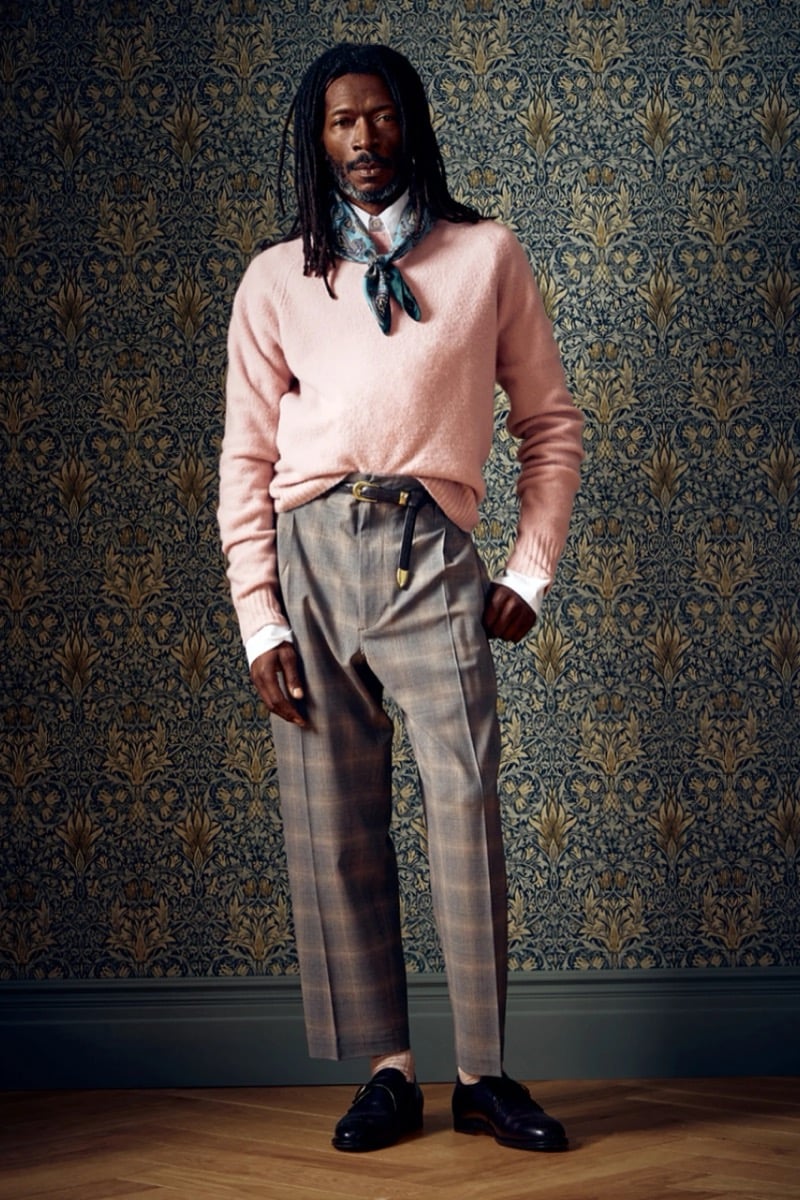 Man in a pink sweater and checked trousers with a teal neckerchief, for Todd Snyder Fall 2026