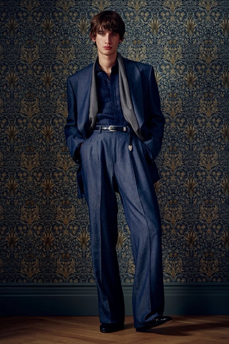 Man in a denim-blue suit with a striped scarf draped over the shoulders, for Todd Snyder Fall 2026
