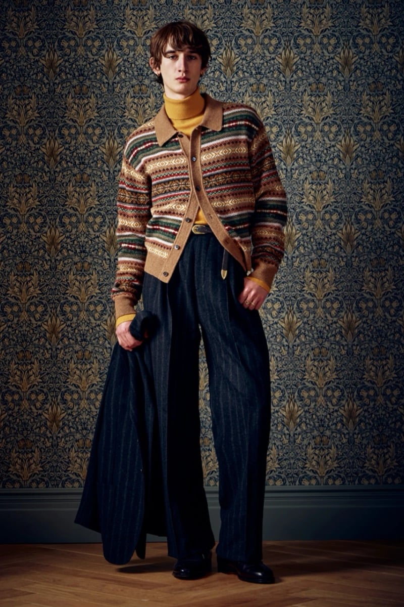 Man in a fair isle cardigan over a mustard turtleneck and pinstripe trousers, for Todd Snyder Fall 2026