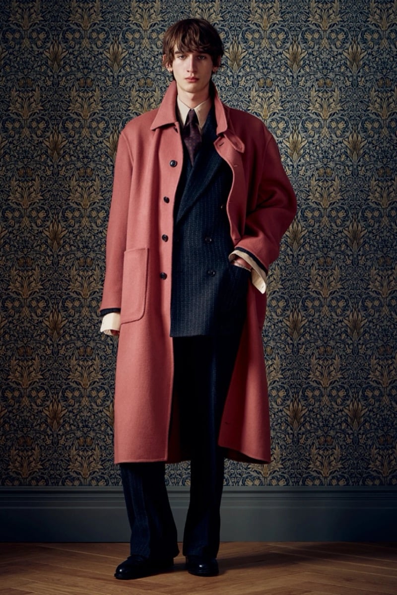Man in a rust wool overcoat over a pinstripe suit and tie, for Todd Snyder Fall 2026