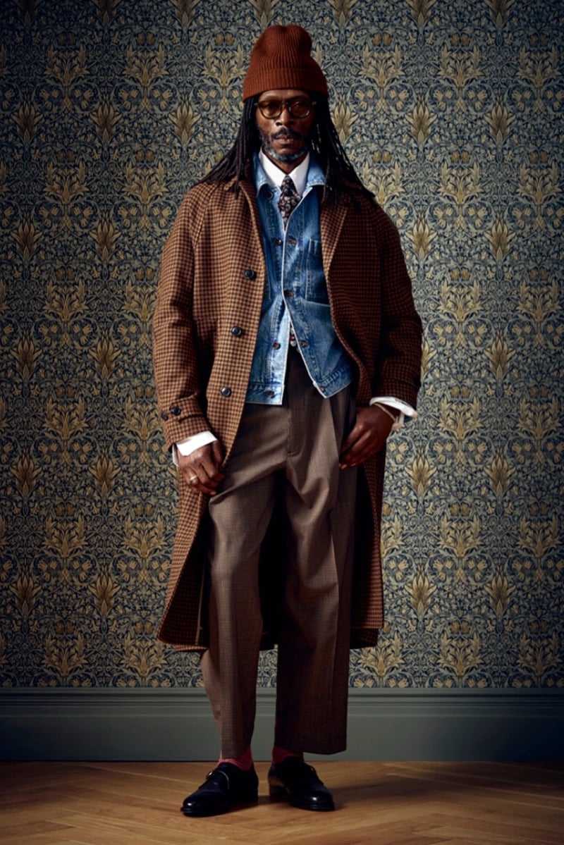 Man in a brown houndstooth coat layered over a denim jacket and tie, for Todd Snyder Fall 2026