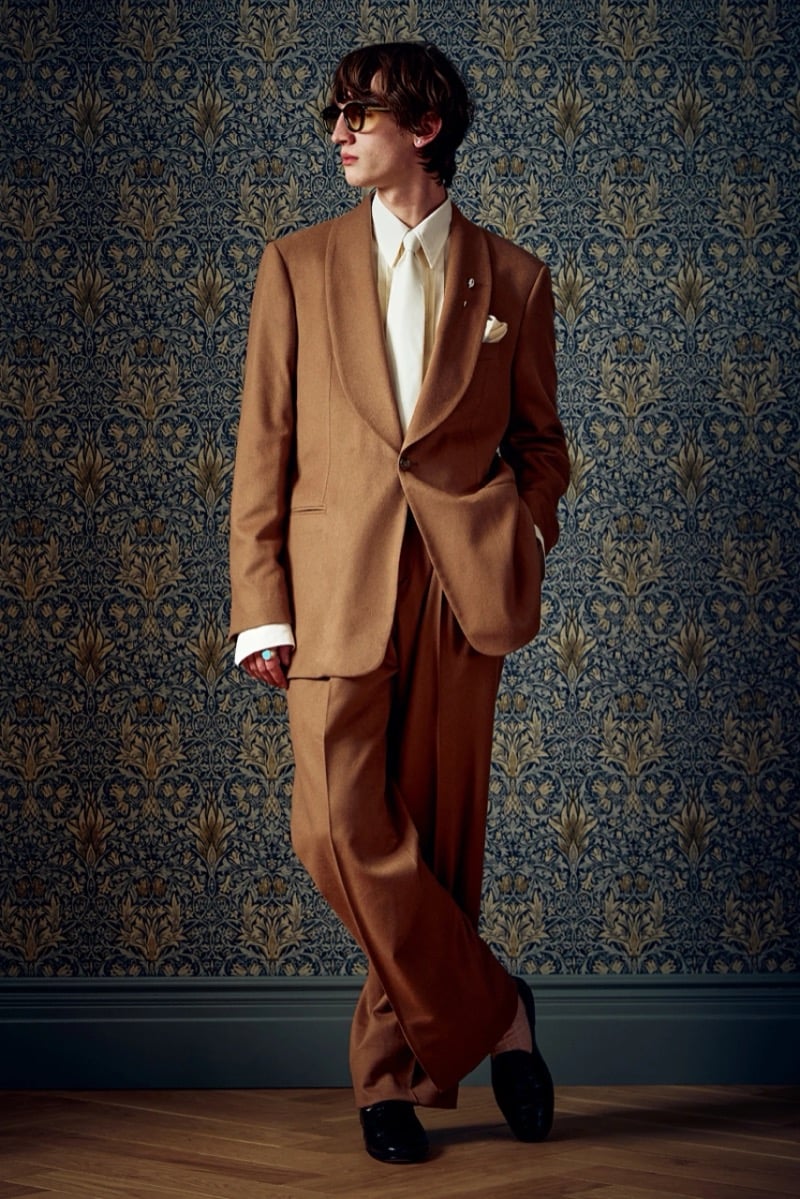 Man in a camel suit with sunglasses and a pocket square, for Todd Snyder Fall 2026