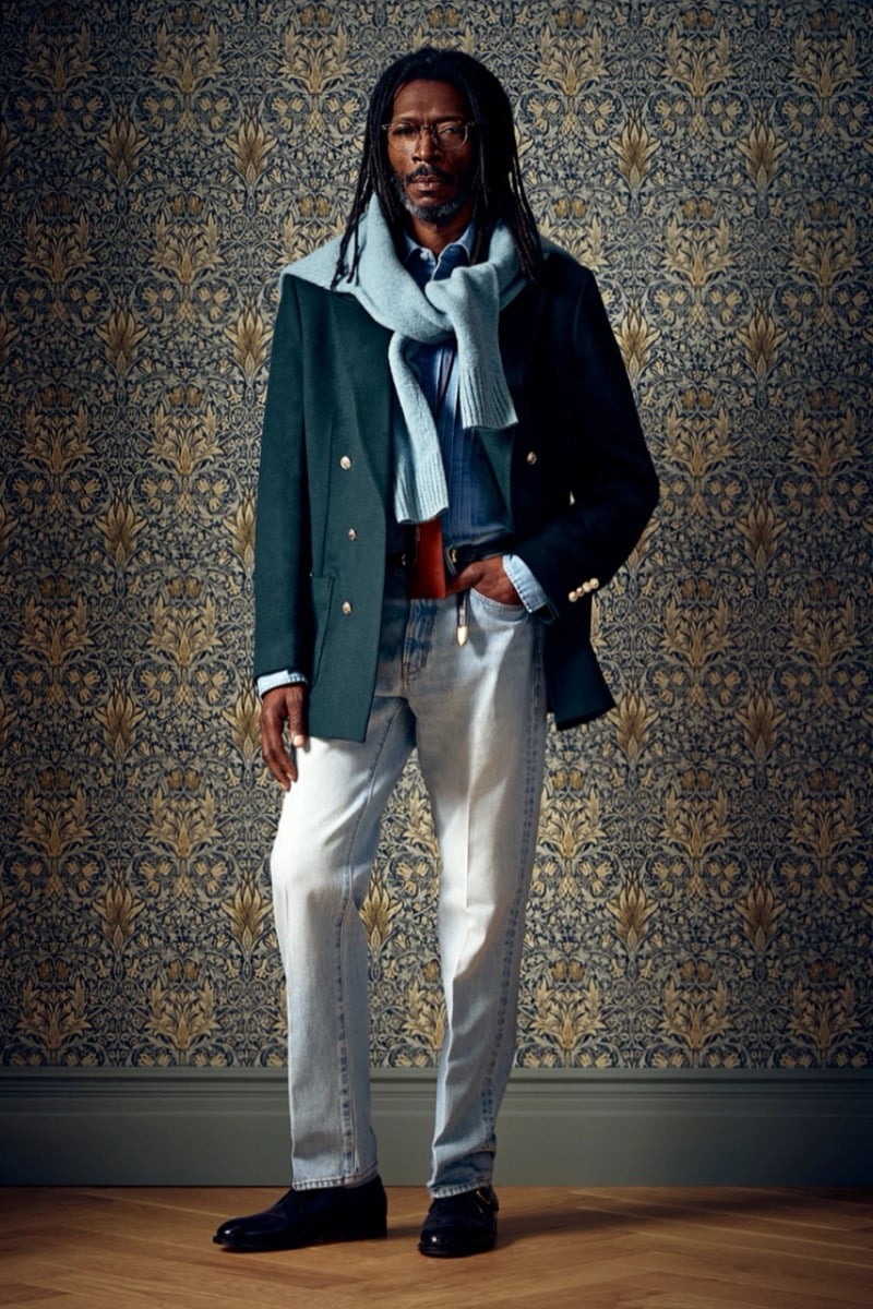 Man in a dark green blazer with a light blue scarf over a denim shirt, for Todd Snyder Fall 2026