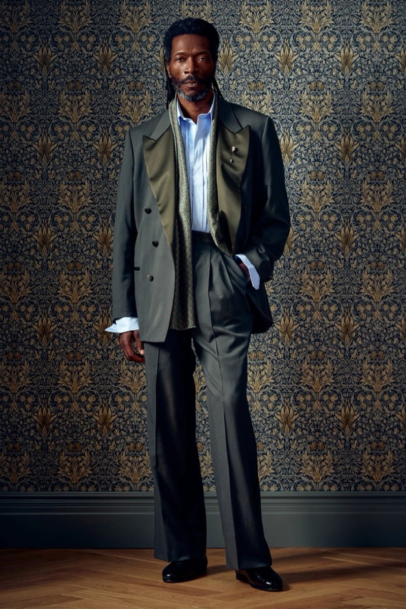 Man in an olive suit with satin lapels and a light blue shirt, for Todd Snyder Fall 2026