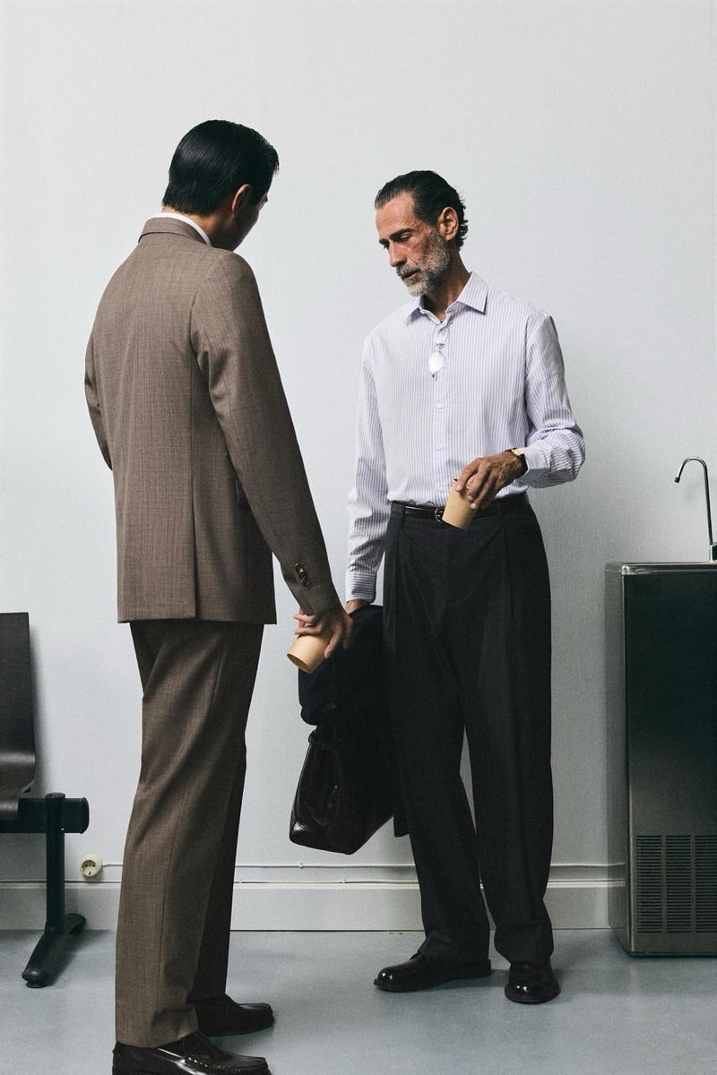 Daisuke Ueda in a brown suit and John Armstrong in a striped shirt exchange coffee cups for Zara's back to work 2026 campaign