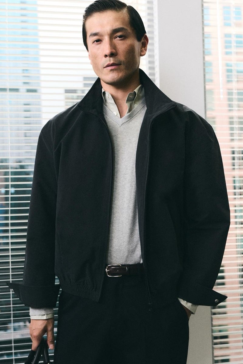 Daisuke Ueda wears a black jacket over a gray v-neck sweater for Zara's back to work 2026 campaign