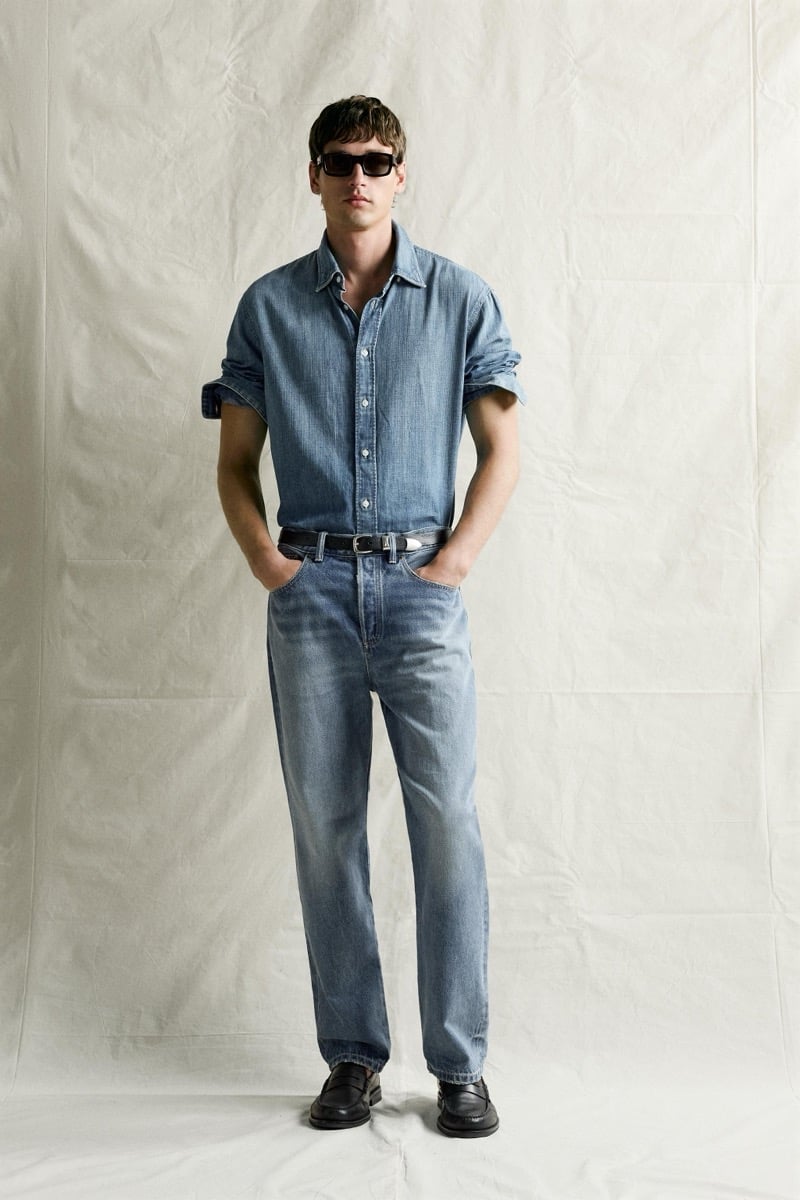 Jegor Venned in a denim shirt and jeans with sunglasses, a double-denim look