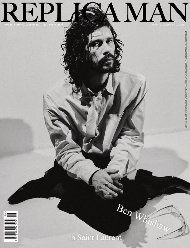 Black-and-white Replica Man Issue 16 cover of Ben Whishaw sitting cross-legged on the floor in an oversized shirt and loose tie with dark trousers, clear sunglasses on the ground beside him