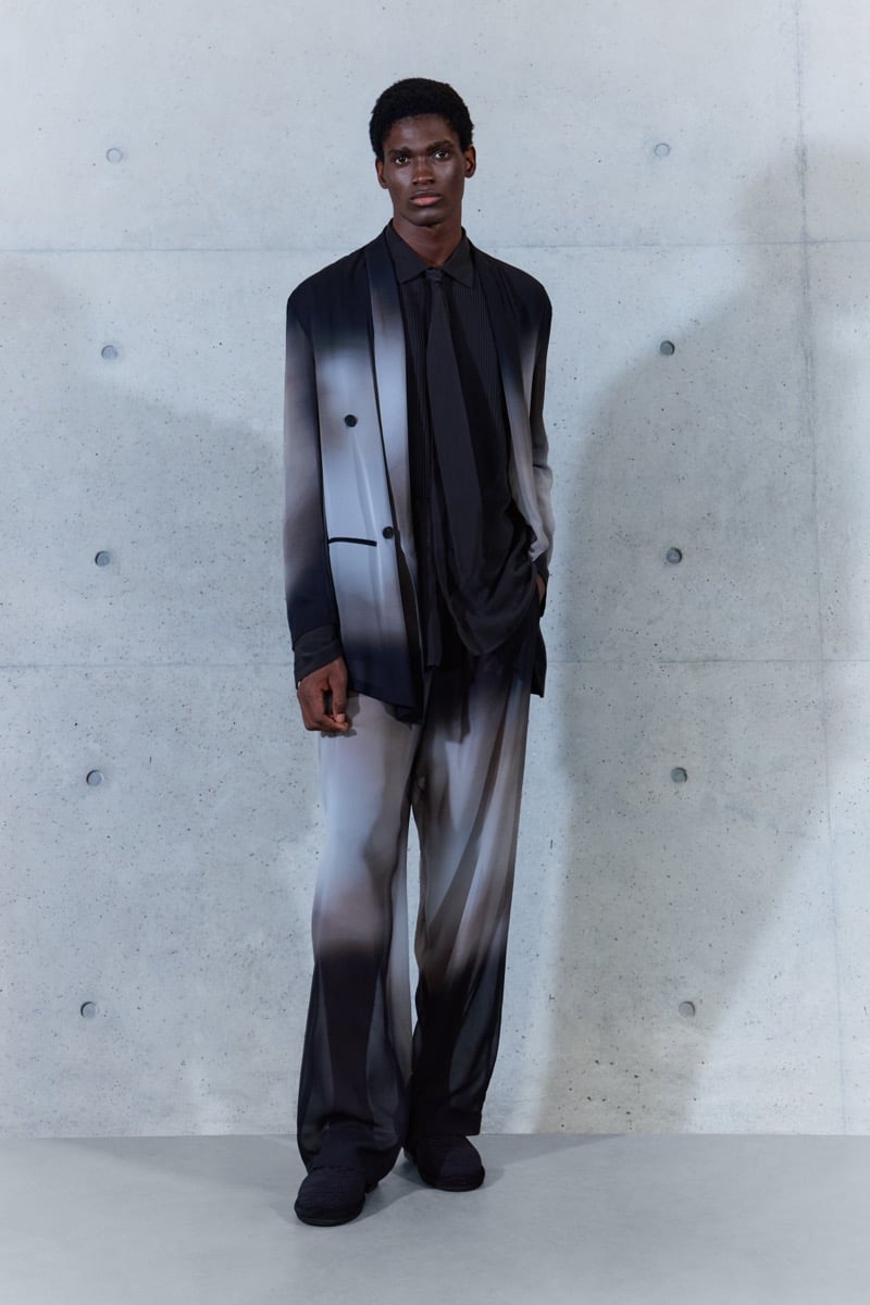 A model in a gradient shawl-collar jacket over a shirt and tie, with matching trousers, for Emporio Armani's spring-summer 2027 collection