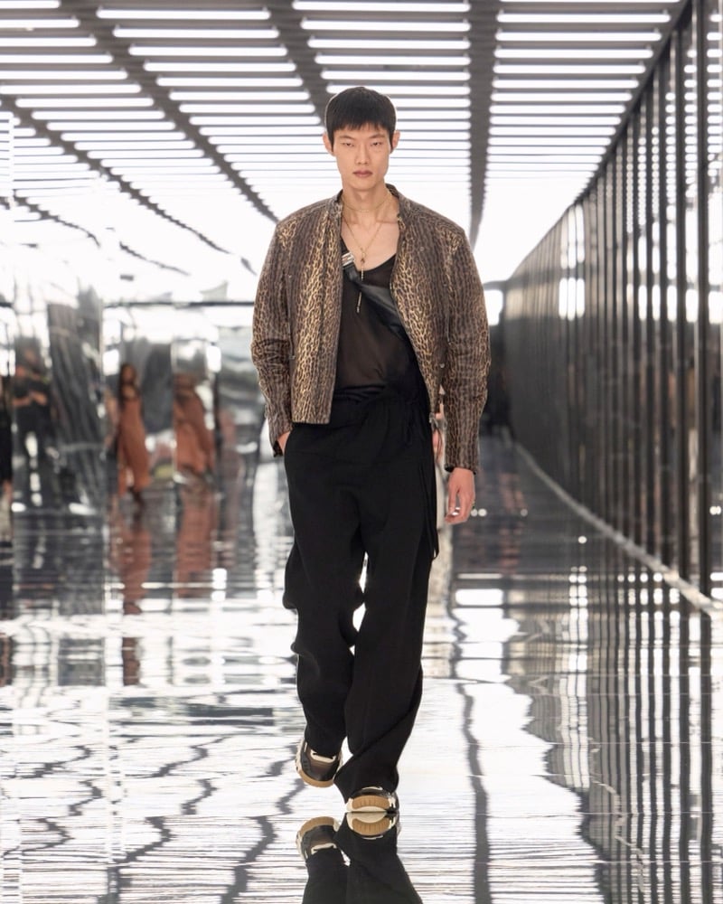 A model in a leopard-print leather jacket over a sheer tank, with trousers and a crossbody bag, for Fendi's spring-summer 2027 collection