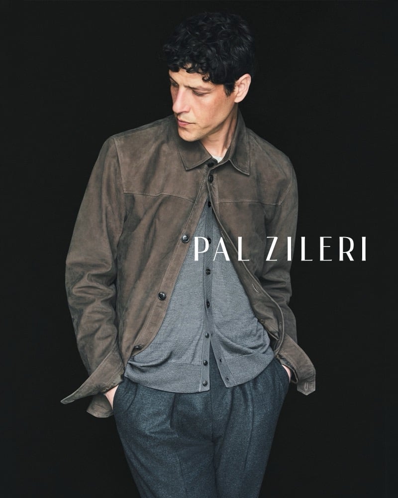 Itshak Vanunu wears a brown suede shirt jacket over a knit cardigan beside the Pal Zileri wordmark, from the brand's fall-winter 2026 campaign.