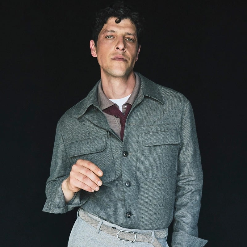 Itshak Vanunu adjusts his cuff in a gray twill overshirt and knit tie for Pal Zileri's fall-winter 2026 campaign.