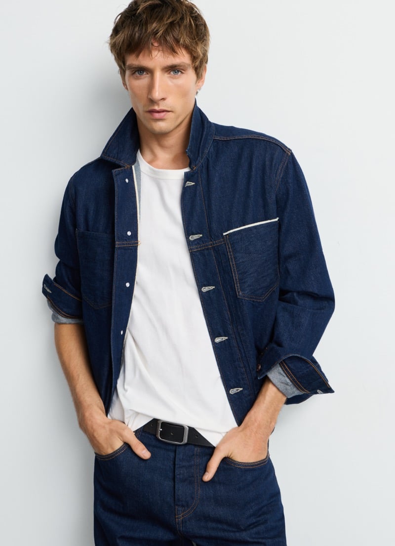 Samuel Curtis in Pepe Jeans' rigid selvedge trucker jacket with rolled cuffs and a white tee, for the brand's Italian Selvedge capsule